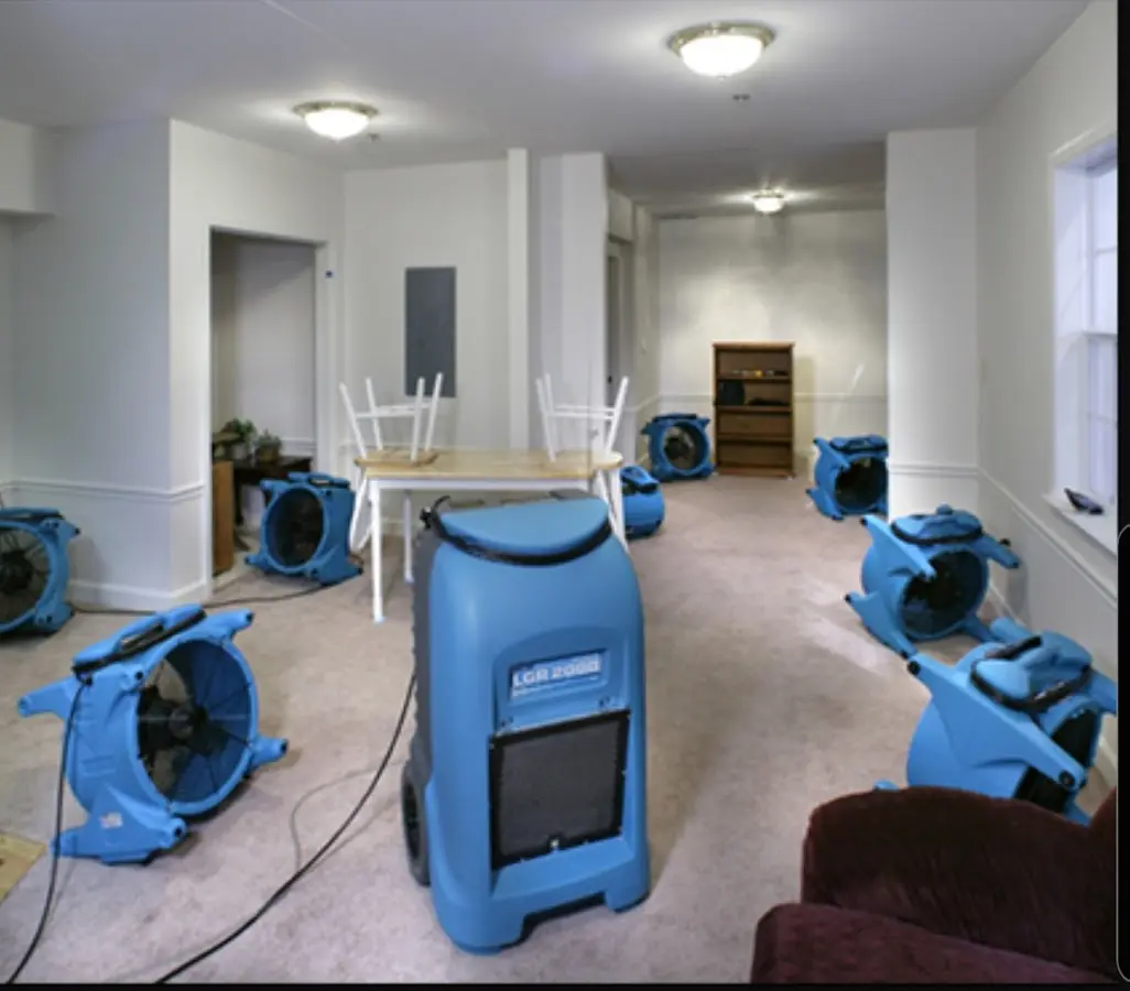 Air movers and dehumidifier setup for Water Damage Restoration in Norwood